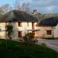 Finished house as garden matures title=
